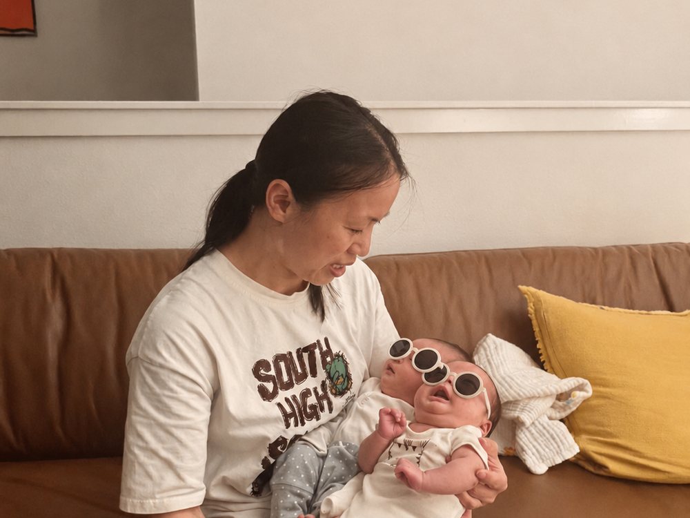 Rainy soothing a newborn during a feed