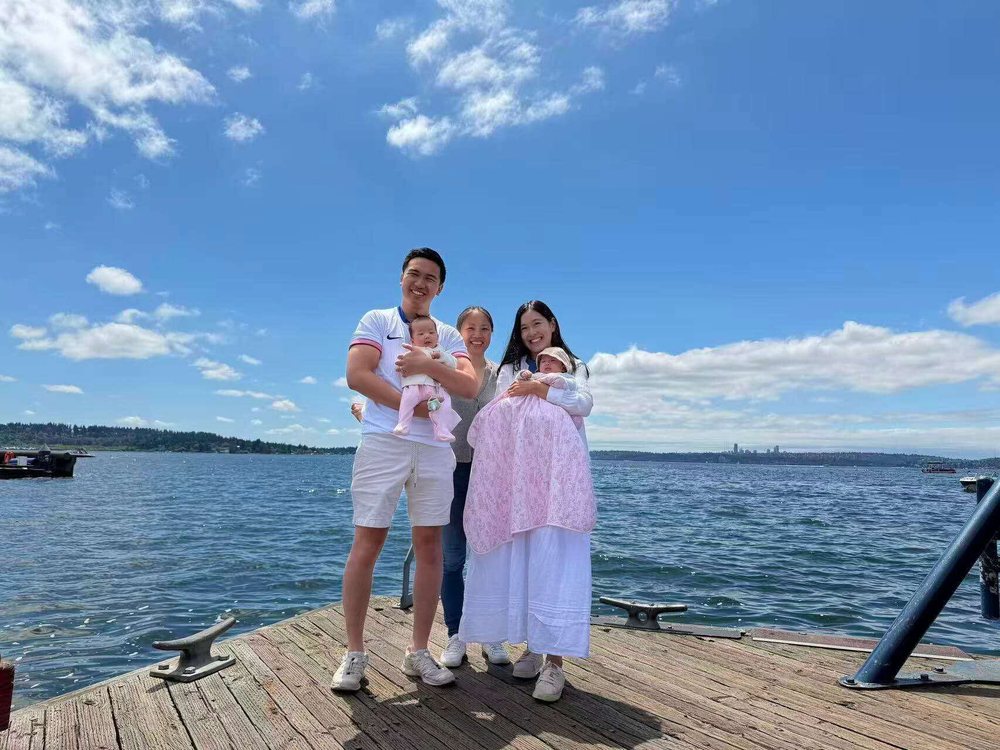 Rainy with a family she supported and their twin newborns