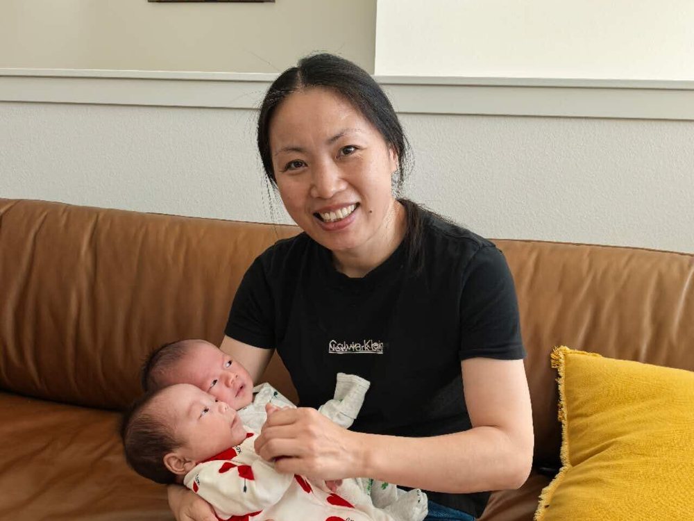 Rainy holding newborn twins
