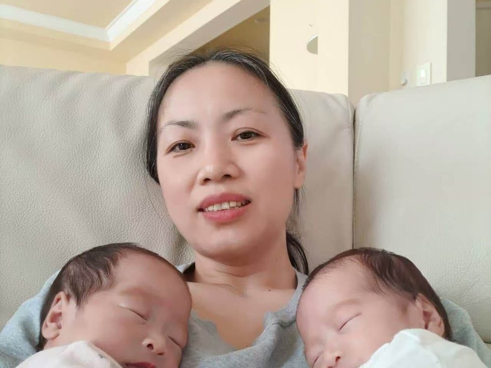 Rainy resting with twin newborns