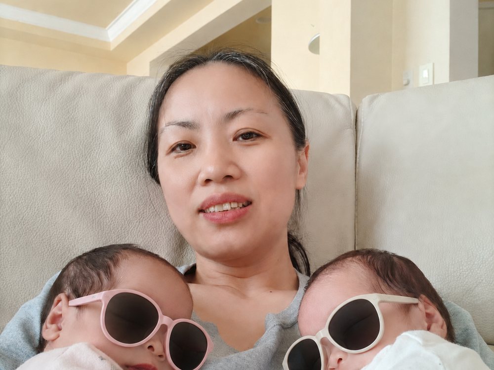 Rainy resting with twin newborns