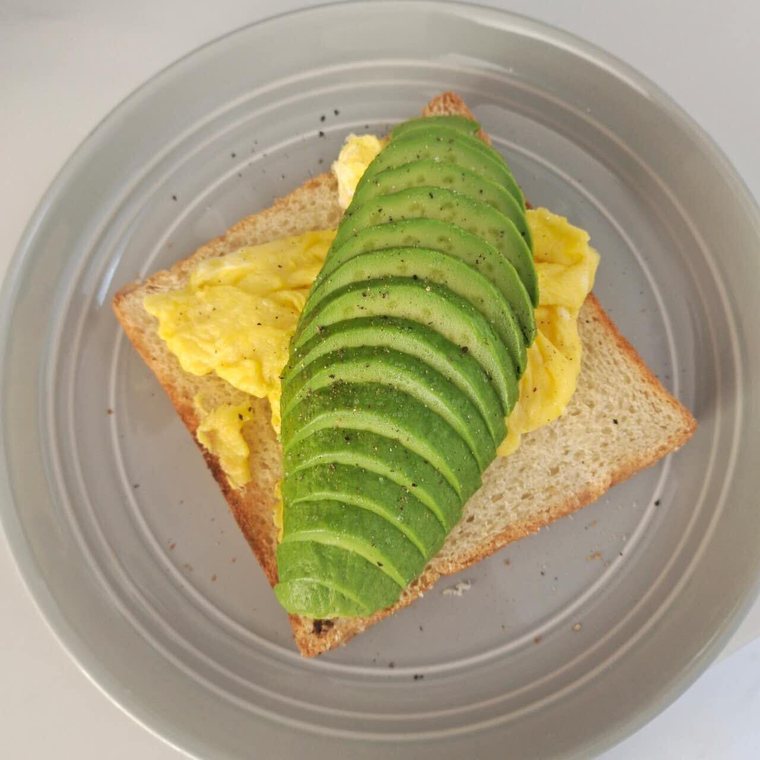 Light breakfast: avocado and scrambled egg on toast